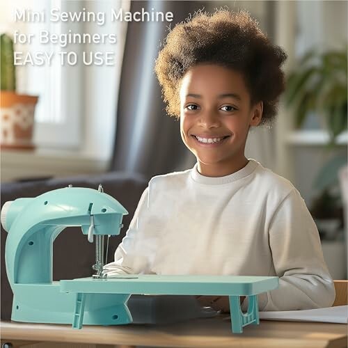 Child smiling while using a mini sewing machine.